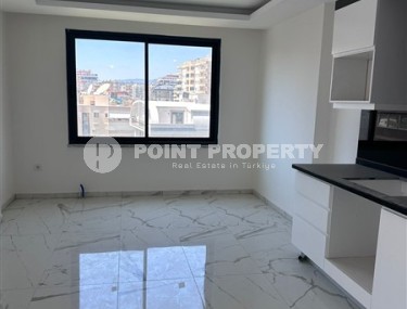 Spacious 1+1 apartment on the 3rd floor of a new modern complex in the center of Mahmutlar-id-8157-photo-5