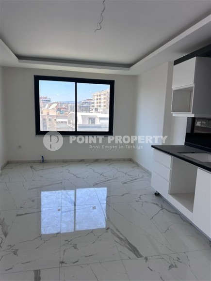 Spacious 1+1 apartment on the 3rd floor of a new modern complex in the center of Mahmutlar-id-8157-photo-5