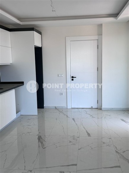 Spacious 1+1 apartment on the 3rd floor of a new modern complex in the center of Mahmutlar-id-8157-photo-6
