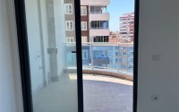 Spacious 1+1 apartment on the 3rd floor of a new modern complex in the center of Mahmutlar-id-8157-photo-9