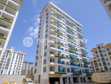 Новая квартира 1+1 в современном жилом комплексе на 1-м этаже в Махмутлар-id-8162-photo-1