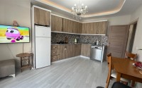Уютная квартира 1+1 в современном жилом комплексе на 6-м этаже в Махмутлар-id-8163-фото-2