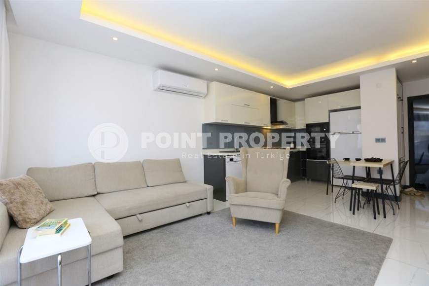 Cozy 1+1 apartment in a modern building on the 2nd floor, in the center of Alanya-id-8165-photo-2