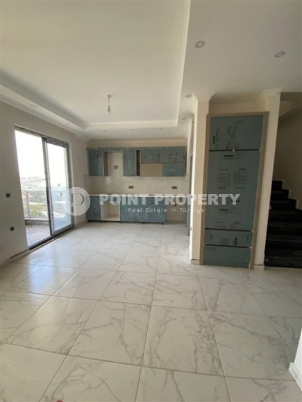 Прекрасная двухуровневая квартира ждет вас в Махмутларе-id-8201-фото-2