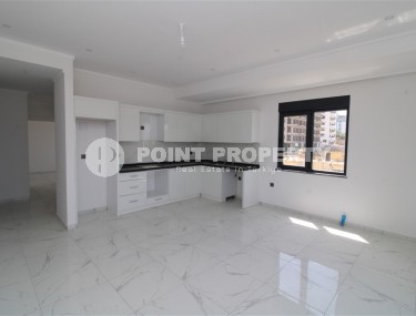 Просторная новая квартира в оживленном Махмутларе!-id-8220-фото-2