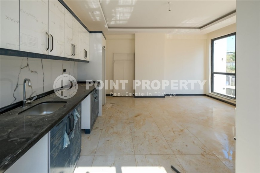 Апартаменты в жилом комплексе на завершающем этапе строительства, планировкой 3+1, в районе Махмутлар-id-5413-фото-4