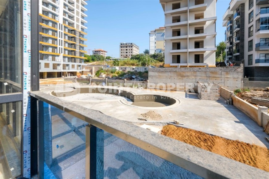 Апартаменты в жилом комплексе на завершающем этапе строительства, планировкой 3+1, в районе Махмутлар-id-5413-фото-16