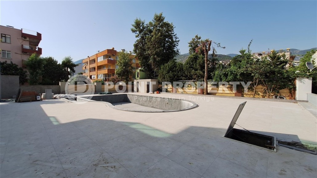 Двухкомнатные квартиры и квартиры-студии, 32-65м², в новом проекте с бассейном в центре Алании-id-2284-фото-8