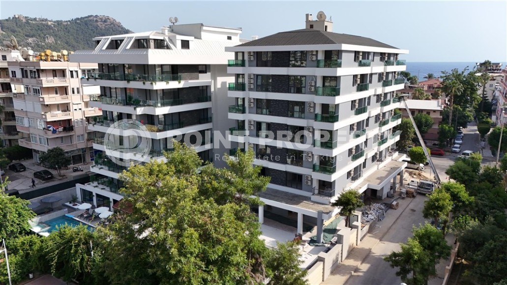 Двухкомнатные квартиры и квартиры-студии, 32-65м², в новом проекте с бассейном в центре Алании-id-2284-фото-20