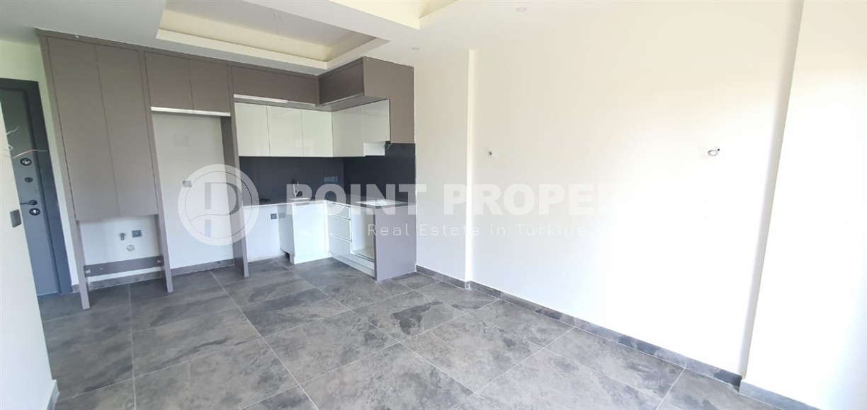 Небольшая новая квартира с чистовой отделкой в 650 метрах от моря, в центре популярного района Аланьи - Махмутлар-id-7310-фото-2