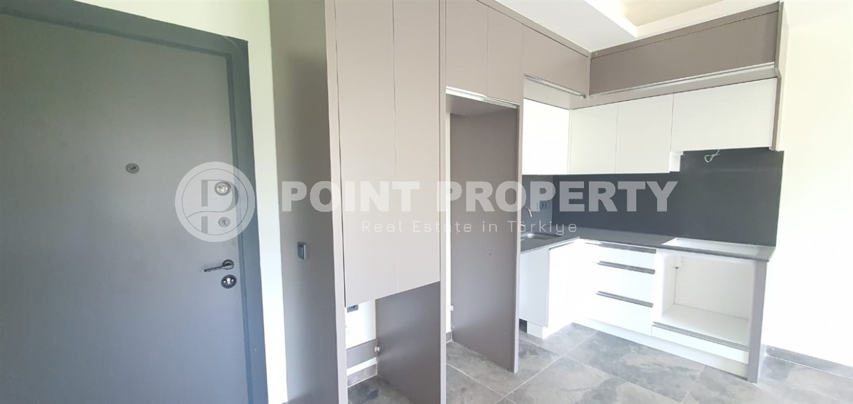 Небольшая новая квартира с чистовой отделкой в 650 метрах от моря, в центре популярного района Аланьи - Махмутлар-id-7310-фото-3