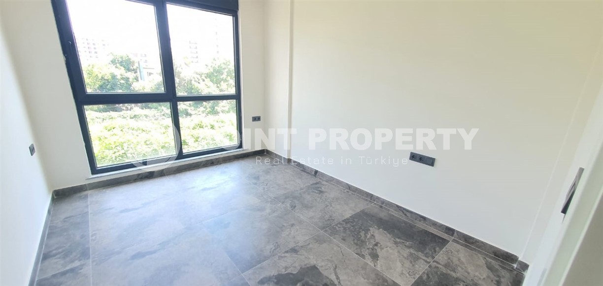 Небольшая новая квартира с чистовой отделкой в 650 метрах от моря, в центре популярного района Аланьи - Махмутлар-id-7310-фото-4