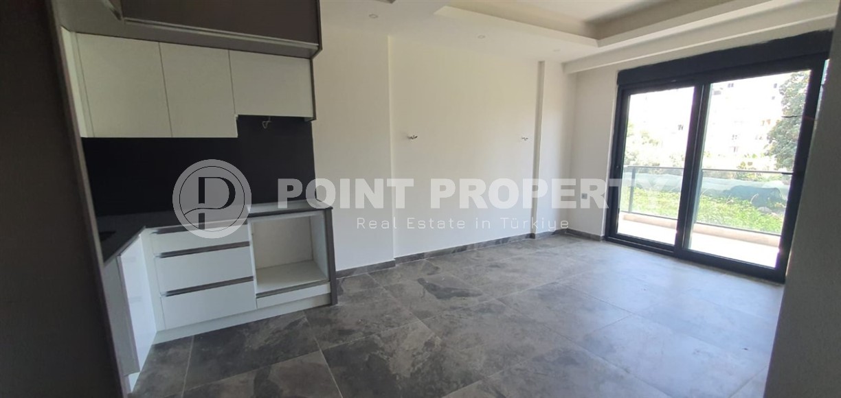 Небольшая новая квартира с чистовой отделкой в 650 метрах от моря, в центре популярного района Аланьи - Махмутлар-id-7310-фото-5