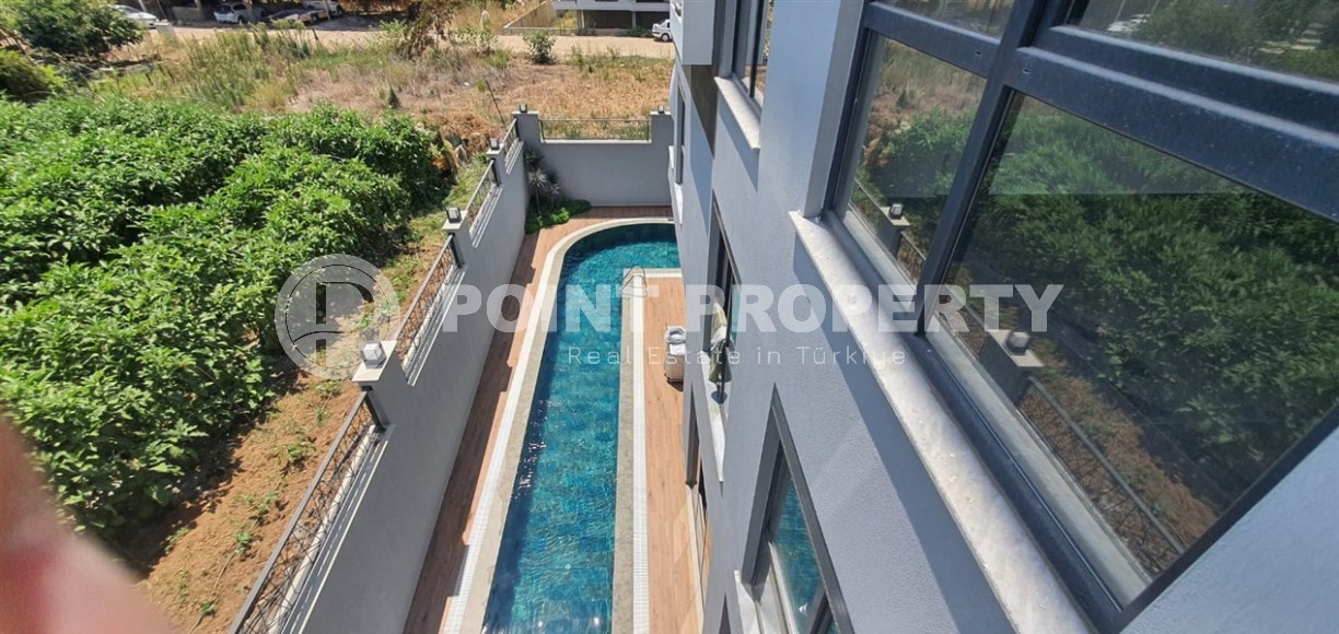 Небольшая новая квартира с чистовой отделкой в 650 метрах от моря, в центре популярного района Аланьи - Махмутлар-id-7310-фото-9