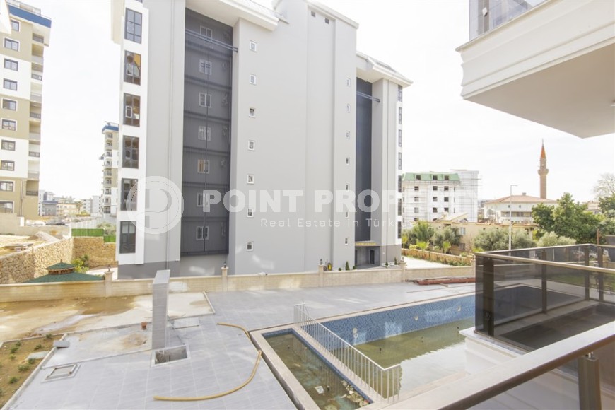 Современная квартира 55 кв.м в новом комплексе в Авсалларе-id-8306-фото-11