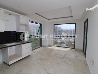 Новая квартира с панорамными видами в Махмутларе-id-8314-фото-2