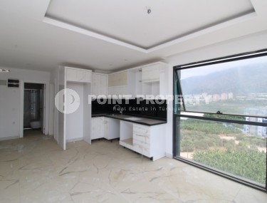 Новая квартира с панорамными видами в Махмутларе-id-8314-фото-3