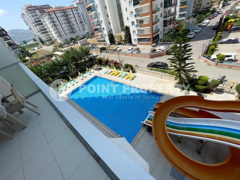 Просторная квартира с двумя балконами в Махмутларе-id-8317-фото-12