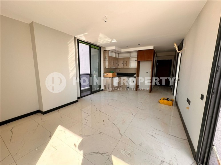 Three apartments in a new building with sea view in Mahmutlar-id-8321-photo-4