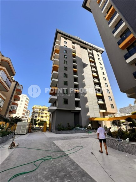 Three apartments in a new building with sea view in Mahmutlar-id-8321-photo-12