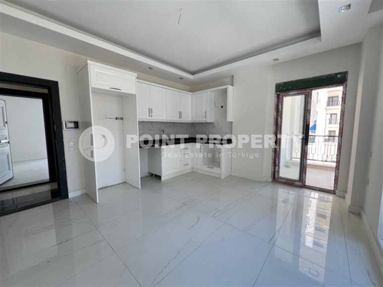 Просторные квартиры 1+1 в новом комплексе в районе Махмутлар-id-8332-фото-2