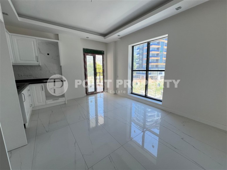 Просторные квартиры 1+1 в новом комплексе в районе Махмутлар-id-8332-фото-3