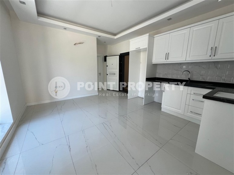 Просторные квартиры 1+1 в новом комплексе в районе Махмутлар-id-8332-фото-4