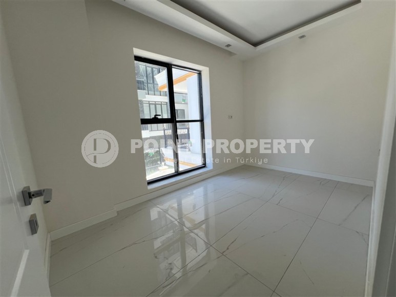 Просторные квартиры 1+1 в новом комплексе в районе Махмутлар-id-8332-фото-5