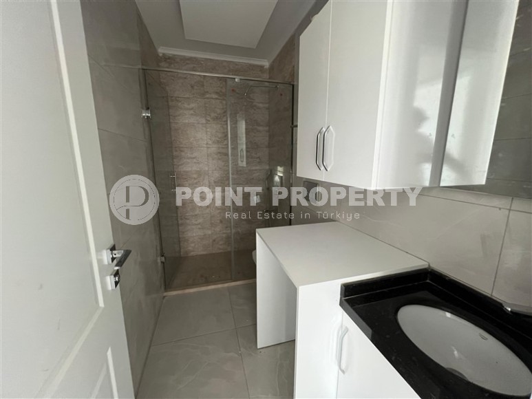 Просторные квартиры 1+1 в новом комплексе в районе Махмутлар-id-8332-фото-6