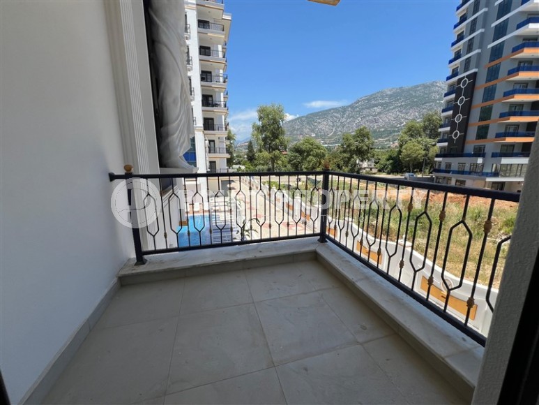 Просторные квартиры 1+1 в новом комплексе в районе Махмутлар-id-8332-фото-7