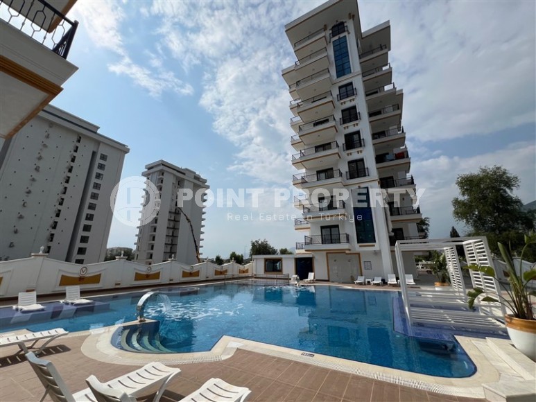 Просторные квартиры 1+1 в новом комплексе в районе Махмутлар-id-8332-фото-15