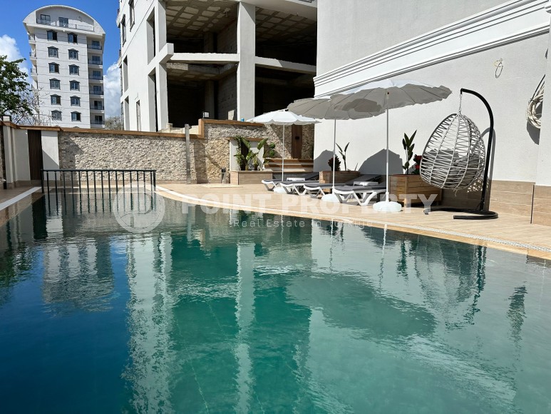 Современная квартира 51 м² в новом комплексе в Махмутларе-id-8363-фото-12