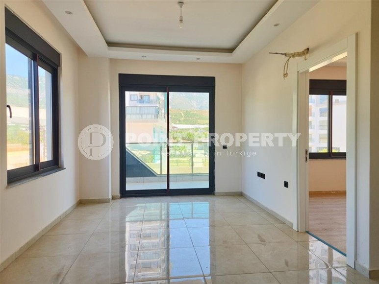 Просторная квартира 60 м² в комплексе с полной инфраструктурой в Махмутларе-id-8372-фото-5