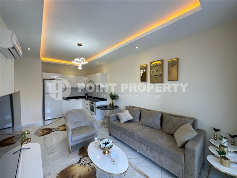 Квартира 1+1 с боковым видом на море в районе Кестель-id-8387-фото-2