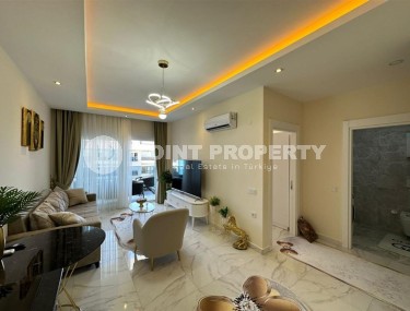 Квартира 1+1 с боковым видом на море в районе Кестель-id-8387-фото-4