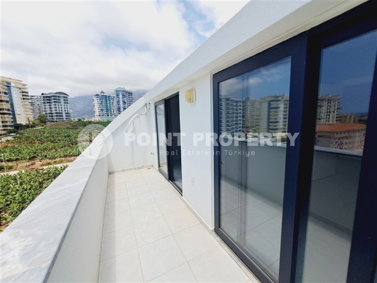 Современный дуплекс 100 м², с террасой в Махмутларе-id-8389-фото-11