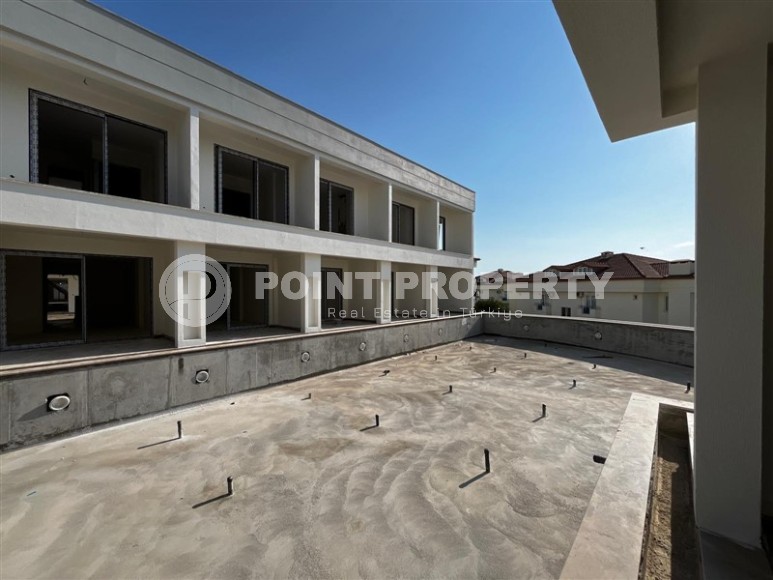 Эксклюзивный проект таунхаусов в 300 метрах от моря в районе Конаклы-id-8412-фото-14