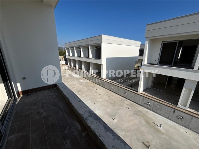 Эксклюзивный проект таунхаусов в 300 метрах от моря в районе Конаклы-id-8412-фото-16