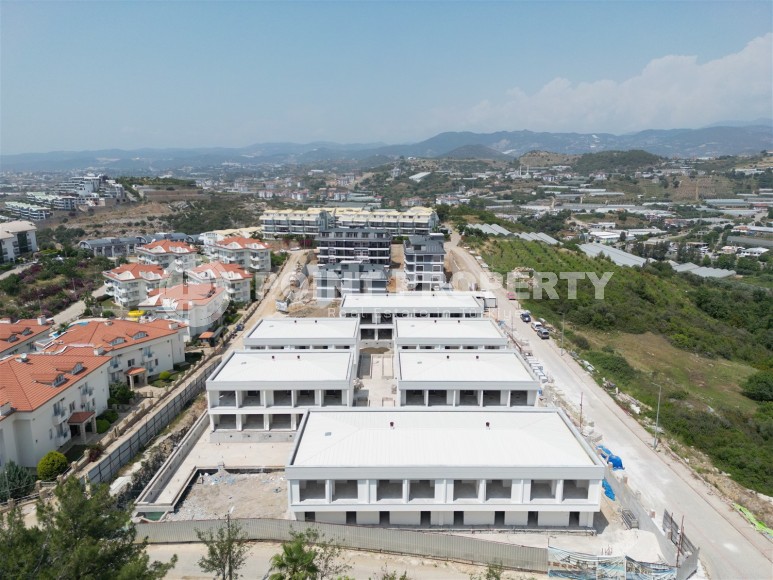 Эксклюзивный проект таунхаусов в 300 метрах от моря в районе Конаклы-id-8412-фото-21