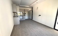 Просторная квартира 55 м² в новом комплексе в Махмутларе-id-8422-фото-2