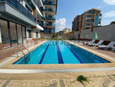 Меблированная двухкомнатная квартира 1+1, в новой резиденции в 250м от моря в районе Кестель, Алания-id-1662-фото-2