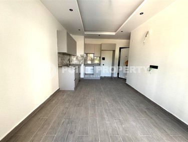 Просторная квартира 55 м² в новом комплексе в Махмутларе-id-8422-фото-3