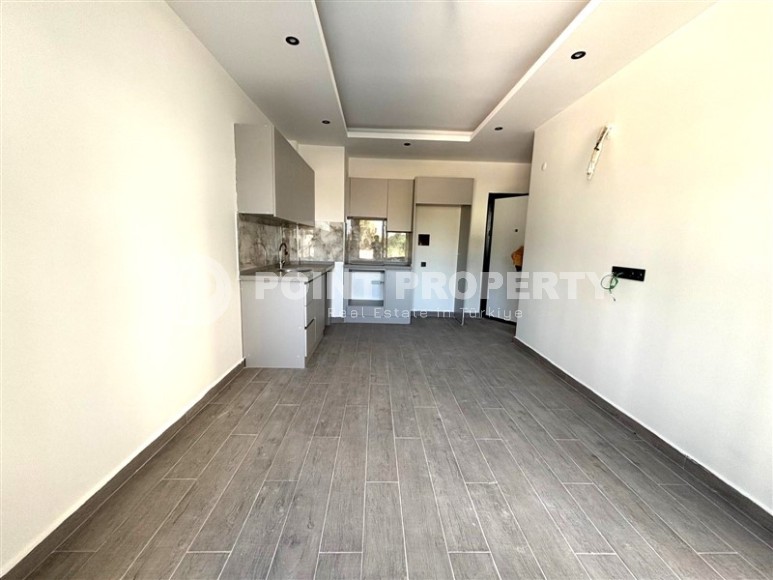 Просторная квартира 55 м² в новом комплексе в Махмутларе-id-8422-фото-3