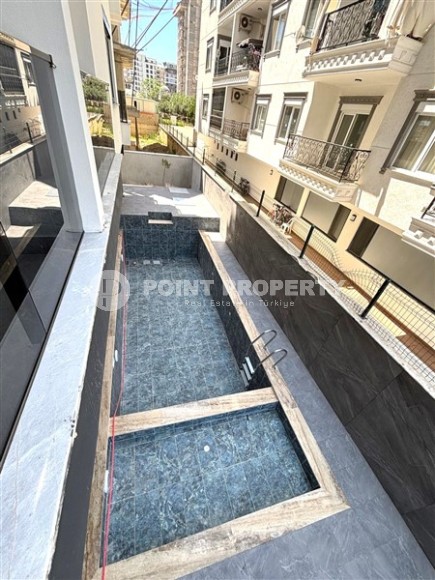 Просторная квартира 55 м² в новом комплексе в Махмутларе-id-8422-фото-12