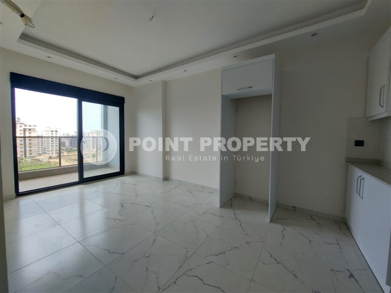 Новая квартира 56 м² в современном комплексе в Махмутларе-id-8428-фото-2