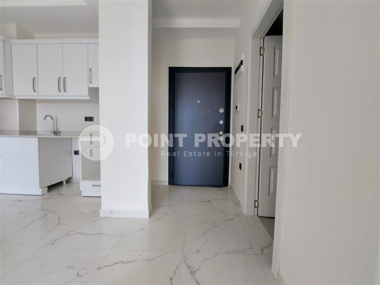 Новая квартира 56 м² в современном комплексе в Махмутларе-id-8428-фото-3