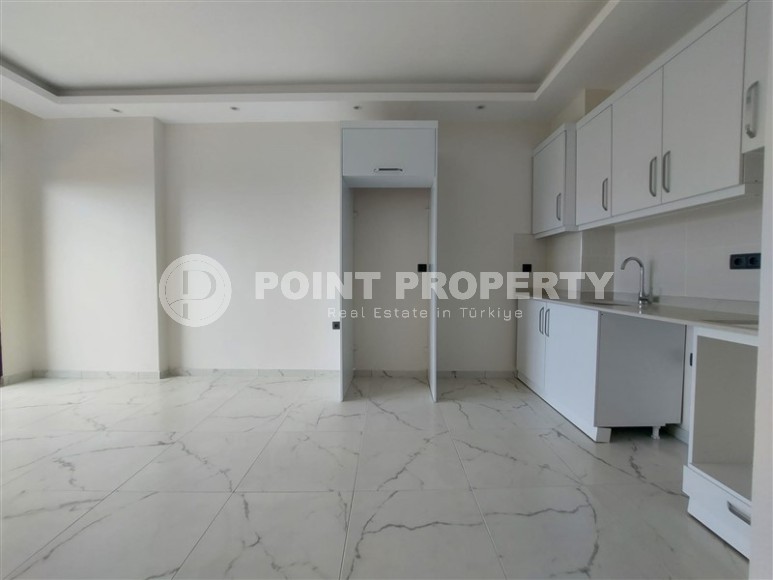 Новая квартира 56 м² в современном комплексе в Махмутларе-id-8428-фото-4