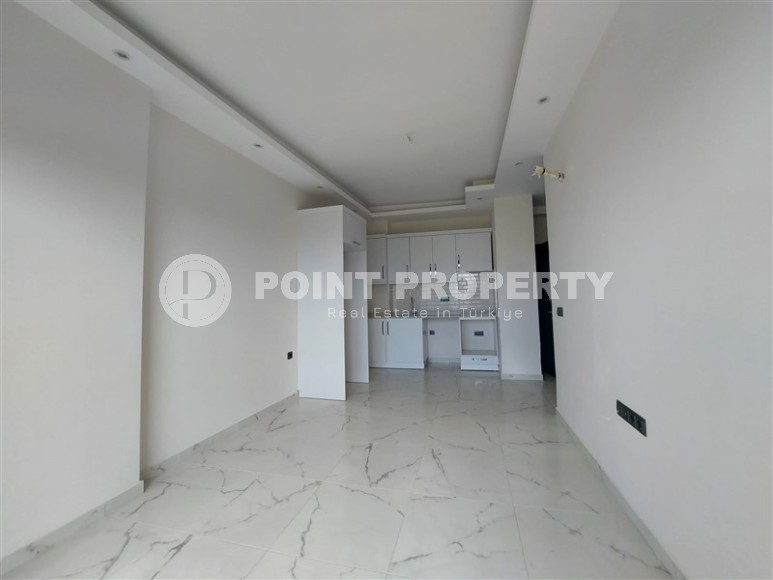 Новая квартира 56 м² в современном комплексе в Махмутларе-id-8428-фото-5