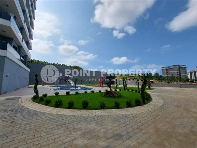 Новая квартира 56 м² в современном комплексе в Махмутларе-id-8428-фото-12