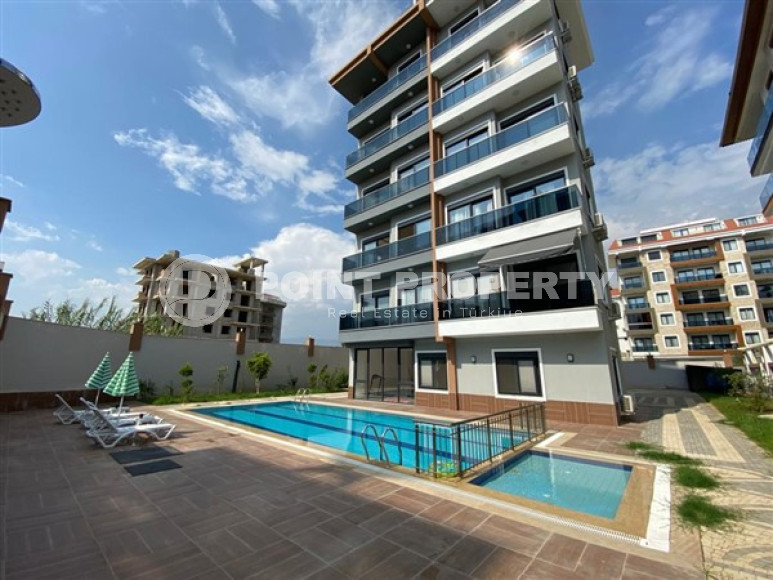 Меблированная двухкомнатная квартира 1+1, в новой резиденции в 250м от моря в районе Кестель, Алания-id-1662-фото-15